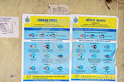 Coronavirus Safety Awareness Disease Control and Prevention slogan Poster on city street wall showing symptoms, Doâ€™s and Donâ€™ Editorial Stock Photo